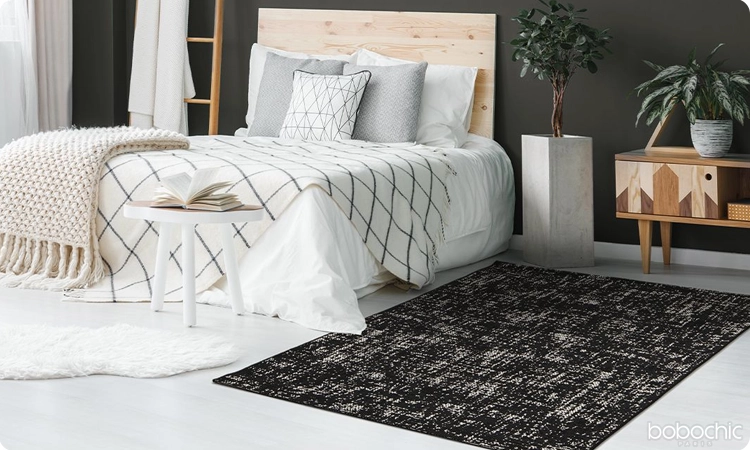 Le tapis sombre peut clairement sublimer la déco de votre chambre